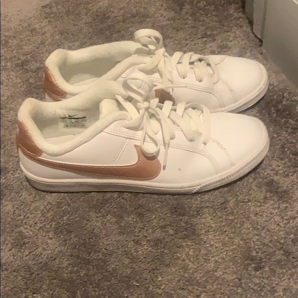 White and rose gold Nike’s